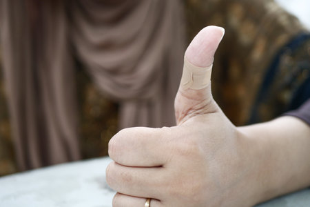 women hand with adhesive bandageの写真素材