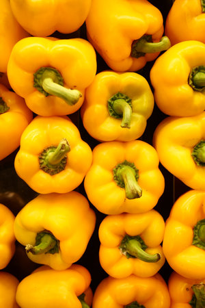 stack of yellow capsicum backgroundの写真素材