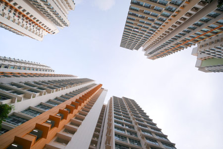 low angle view of signapore residential buildings against blue sky