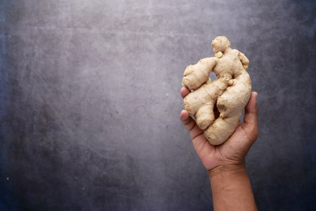 top view of Gingers on hand on black backgroundの写真素材