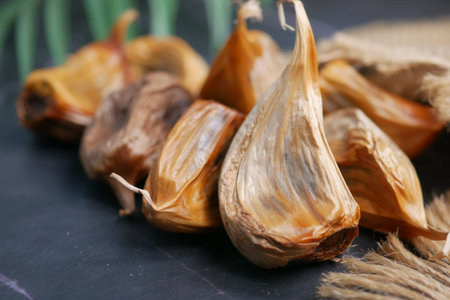 close up pf black garlic on white background table