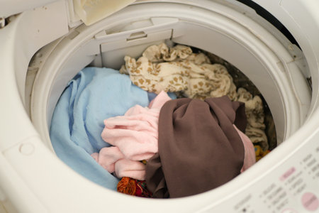 close up of cloths in a washing machine.の写真素材