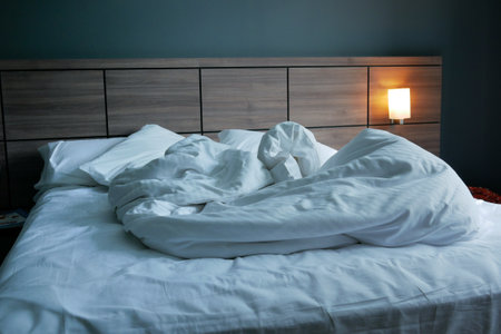 messy bed in early morning , messy bed after waking upの写真素材