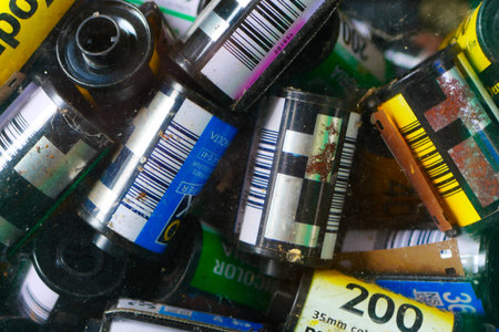 stack of many old 35mm film rolls