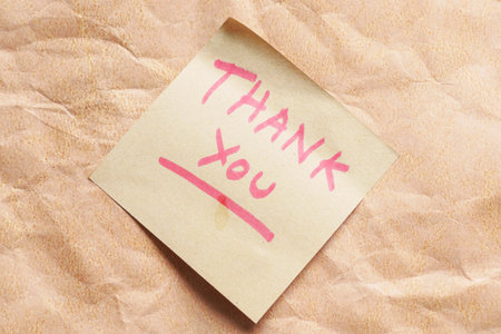 hand written thank you message on sticky note