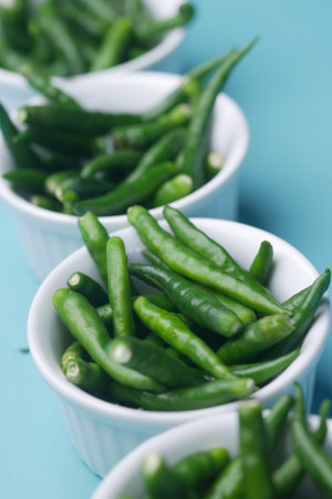lined up green chili in a container