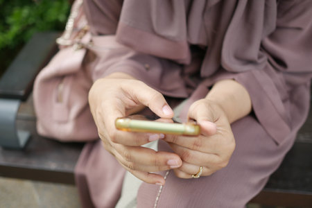 close up of women hand holding smart phoneの写真素材