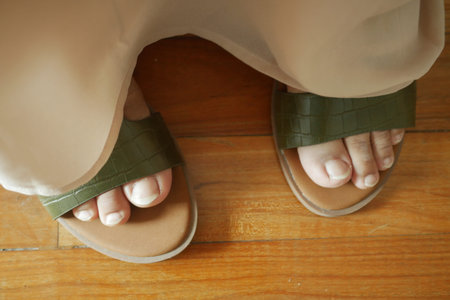 close up of girls feet wearing sandal indoor ,