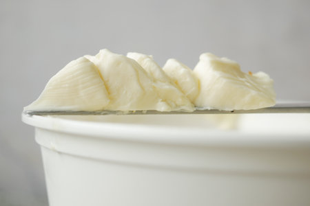 close up of fresh butter in a containerの写真素材