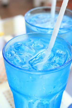 soft drinks with ice in a blue glassの写真素材