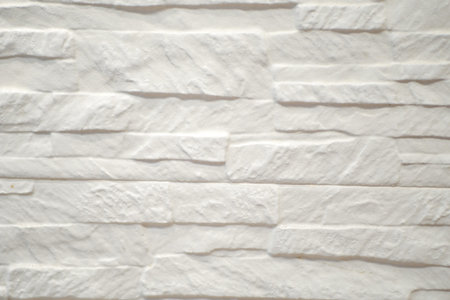detail show of old white brick wallの写真素材