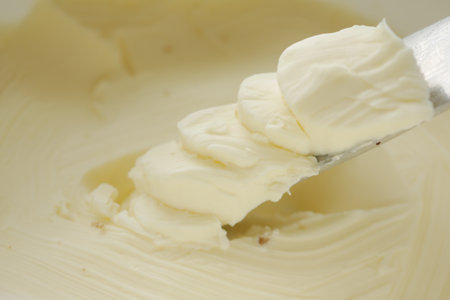 close up of fresh butter in a containerの写真素材