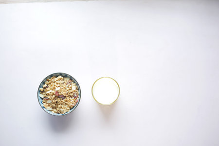 top view of granola Musli in a bowl and milk on table