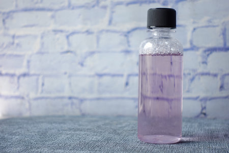 mouthwash liquid in a container on tableの写真素材