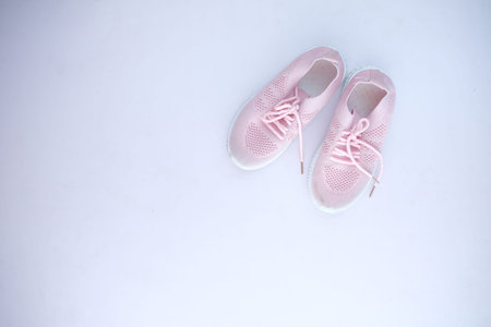 childrens shoes on light purple background