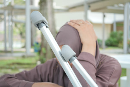 young women with broken leg on crutches.の写真素材