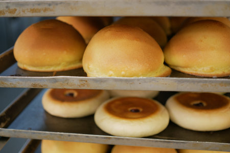 Freshly baked bread lies on the shelves ready for sale.