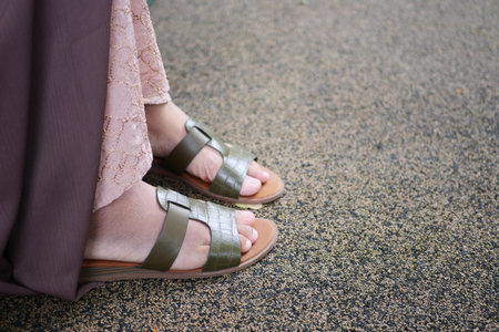 girls feet wearing sandal outdoorの写真素材