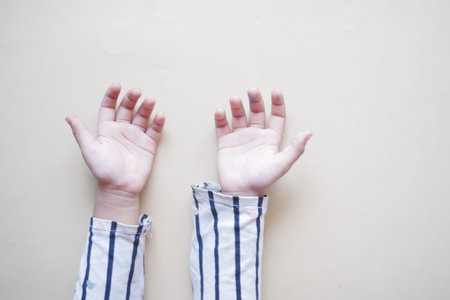 top view of baby hand on black background.の写真素材