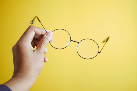 men holding a Old eyeglass