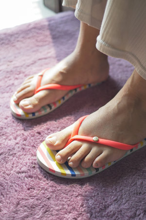 top view of girls feet wearing sandal at early morningの写真素材