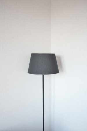 a lamp against white wall at home