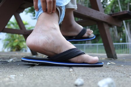 Close up on women feet and hand massage on injury spot.