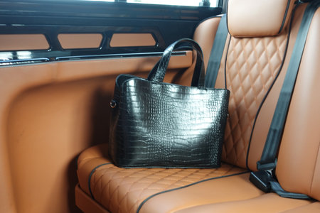 women left her hand bag in a carの写真素材