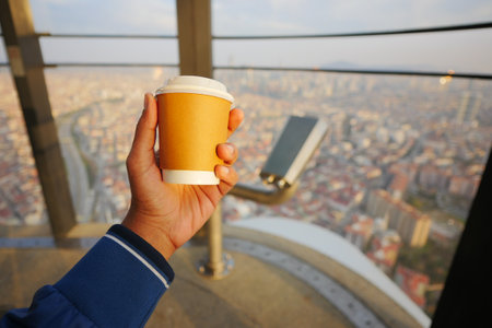 men holding a take away paper coffee cupの写真素材