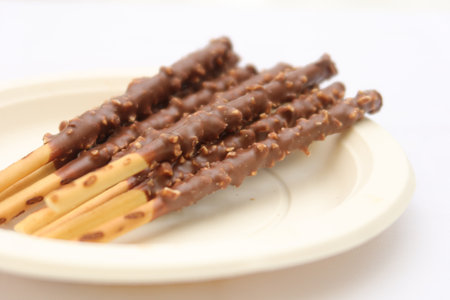 almond nut dark chocolate stick on tableの写真素材
