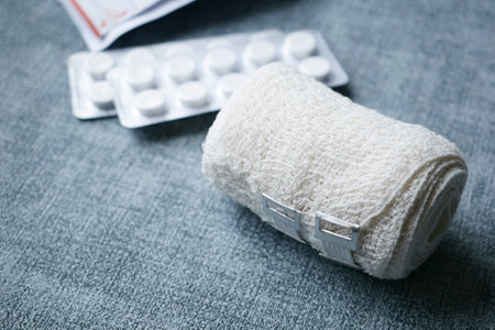 adhesive bandage and a bag on tableの写真素材