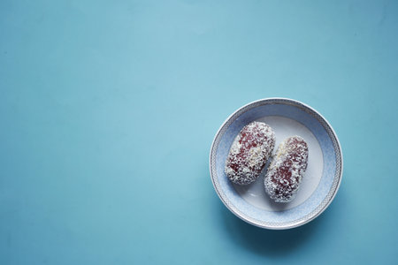 close up of indian sweet in a bowl on table.の写真素材