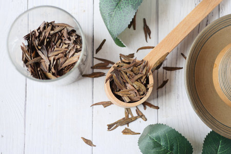 Dry tea leaves on spoon close up .の写真素材