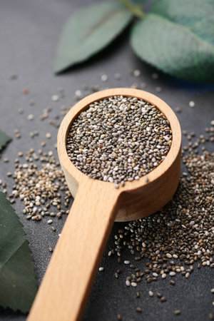 close up of chia seed in a wooden spoon on tableの写真素材