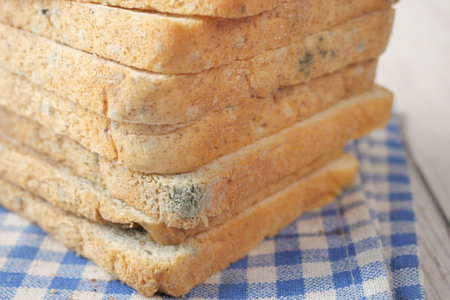 stack of bread with mildew. Spoiled products