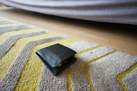 left wallet on floor at homeの写真素材