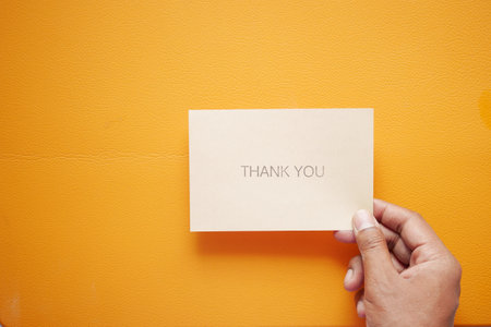 man hand reading a thank you letterの写真素材