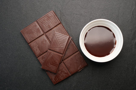 dark chocolate and cream on black background