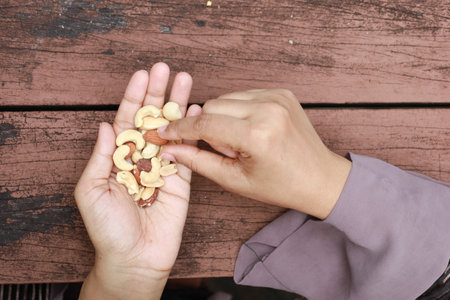 women hand pick mixed nutの写真素材