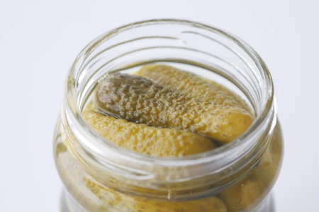 bottle of pickled cucumbers, pickles on table