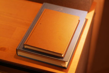stack of books on wooden table