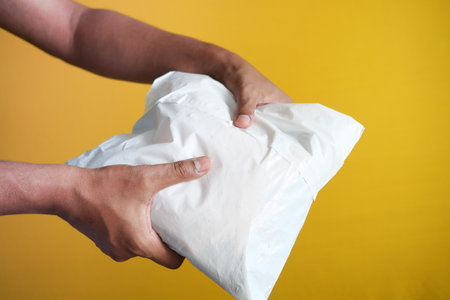 men holding delivery package close upの写真素材