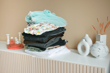 Stack of clothes on table indoor.
