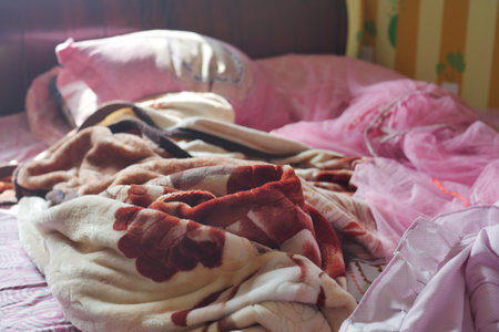 Bed with messy pick color Blankets,の写真素材