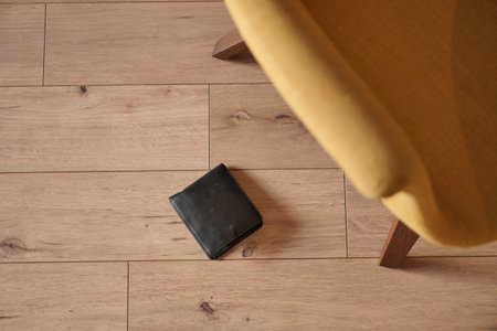 forget smartphone on floor at homeの写真素材