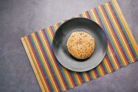 half eaten beef burger on table close up
