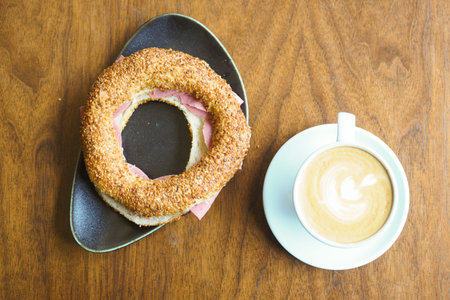 top view of late coffee and simit bread on table .の写真素材