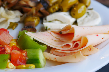 salami sausage cut into thin piecesの写真素材