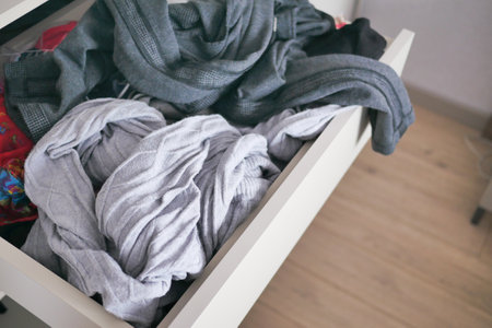 rawer with messy cloths top view ,の写真素材