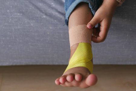 adhesive bandage on child feetの写真素材